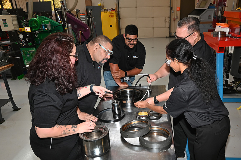 In this photo, technicians and engineers are evaluating components after a test.